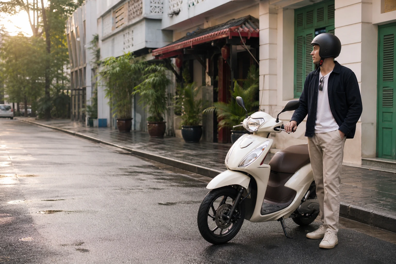 Helmeted traveler standing beside a scooter on a Ho Chi Minh City street